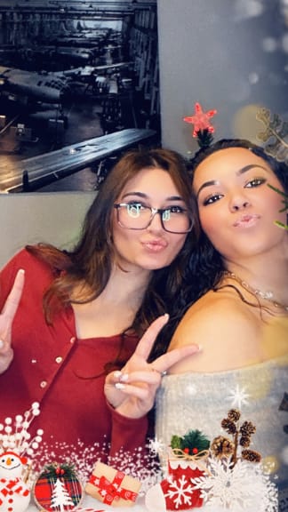 Two girls giving duck-face to the camera