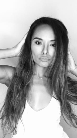 One girl posing in black in white